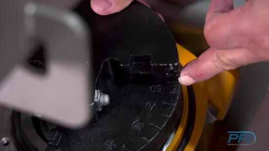 Vibratory conveyor being tuned by a PFI technician.