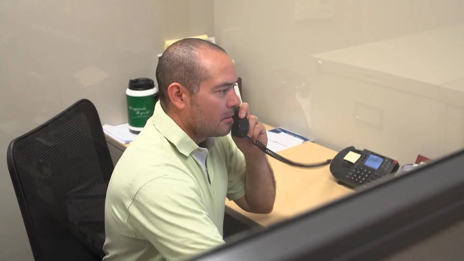 PFI employee on the phone.