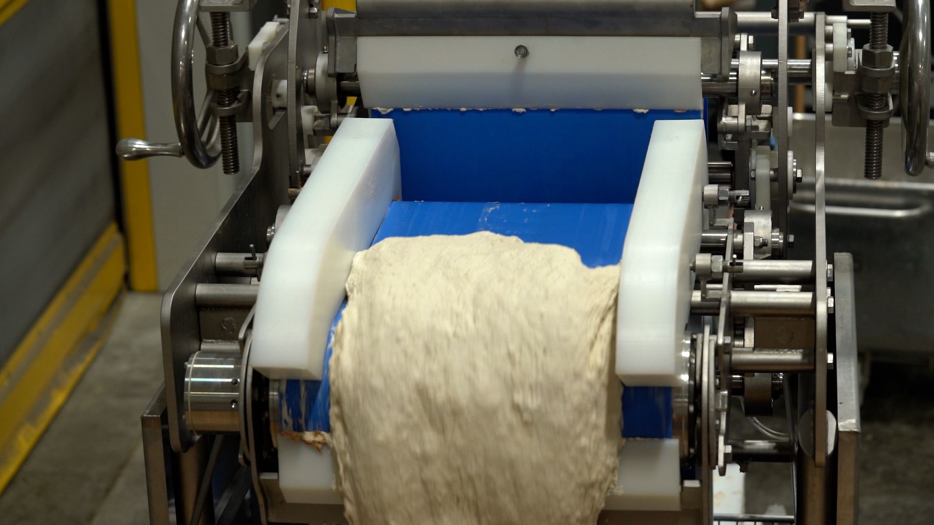 Raw dough on a PFI PURlift conveyor