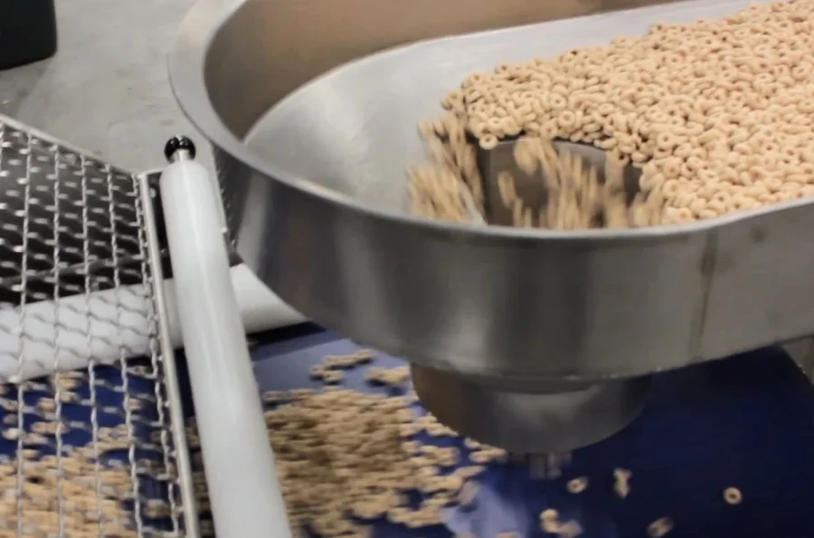 Cereal being conveyed on PFI horizontal motion and lift conveyors.